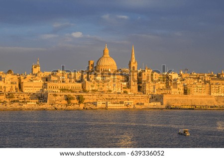 Valletta skyline panorama at sunset with the Carmelite Church dome and St. Pauls Anglican Cathedral. It is part of the UNESCO World Heritage Site. Valletta, Malta