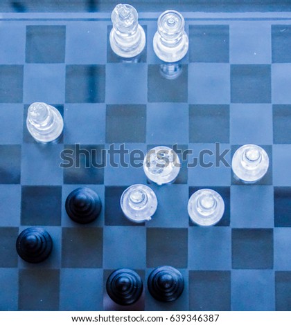 Chess pawns on the chessboard. Closeup