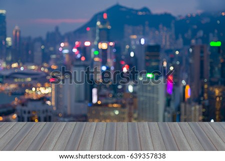 Opening wooden floor, Hong Kong blurred bokeh light business downtown aerial view, abstract background