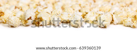 Panorama, caramel popcorn on white background, funfair and cinema snack