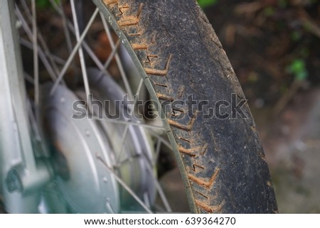 Close up details of an old motorcycles wheels.