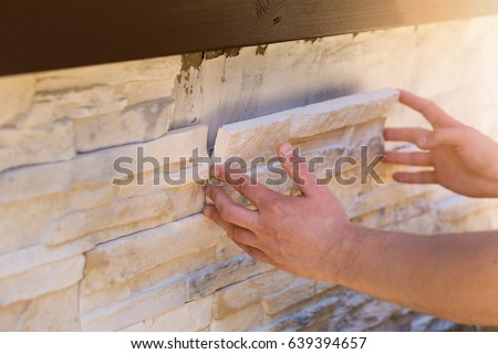 wall facing with decorative stone tiles Royalty-Free Stock Photo #639394657