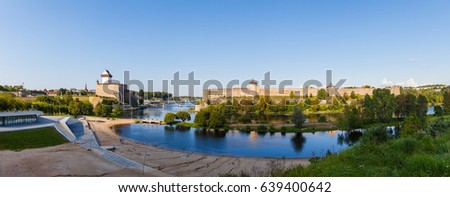 Narva and Ivangorod Fortress on the border of Estonia and Russia. Summer day panoramic view.