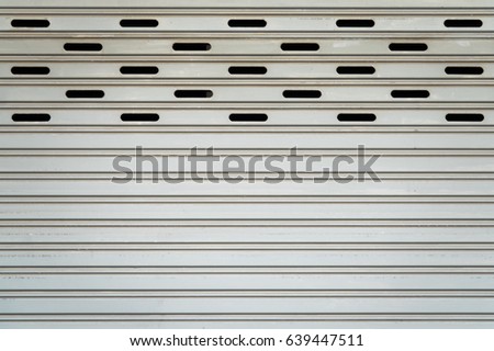 metal security shutters protecting shop
