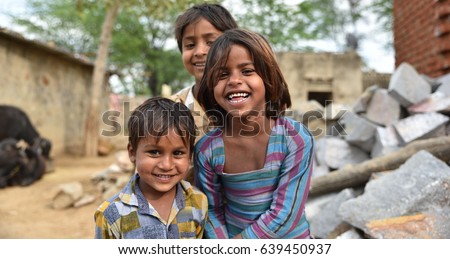 Smiling faces, young children smiling and having fun from rural part of India Royalty-Free Stock Photo #639450937