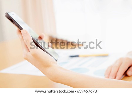 Women using her Smartphone 