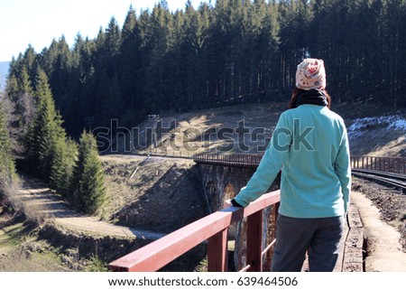 Lonely girl on a railway bridge. Vorokhta, Ukraine