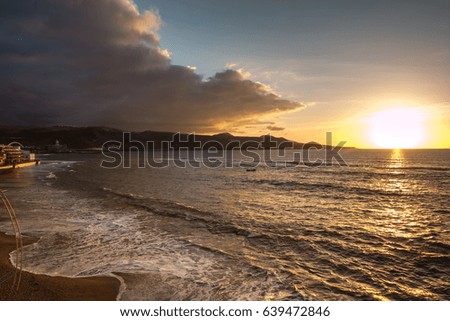 Mountains of Gran Canaria, Tenerife, sunset over the ocean, fishing boat tied, sea stones