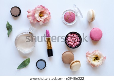 Woman white desktop with flowers and accessories, top view