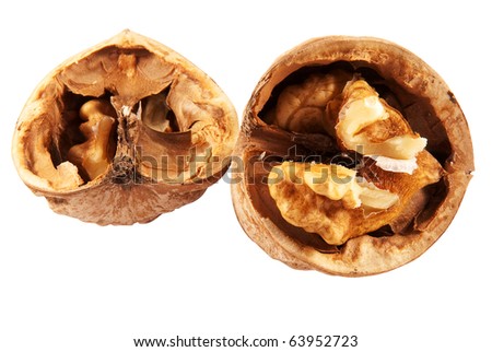 whole and chopped walnuts isolated on a white background