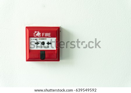 Push button switch fire alarm box on cement wall for warning and security system. Copy space background