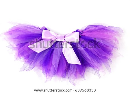 Purple skirt tutu with lilac bow on a white background. Royalty-Free Stock Photo #639568333