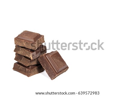 Closed up stack of Dark Chocolate Cubes Isolated on White Background with Free Space for Text and Design 