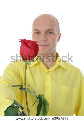 Picture a man in a yellow shirt holding a red rose. Isolated on white background