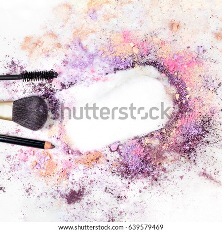 Makeup brush, pencil, and mascara applicator on white marble background, with traces of powder forming a frame. Square template for a makeup artist's business card or flyer design, with copy space
