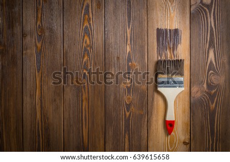 impregnation of boards with a special protective composition from the atmosphere Royalty-Free Stock Photo #639615658