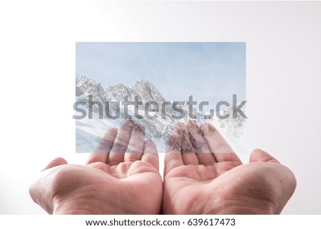 Snow mountain picture in hand.