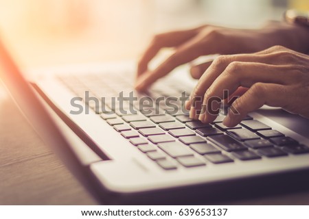 woman using laptop, searching web, browsing information, having workplace at home  / soft focus picture / Vintage concept
