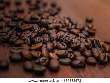 Beautiful coffee beans, Fried coffee beans on a chocolate board.