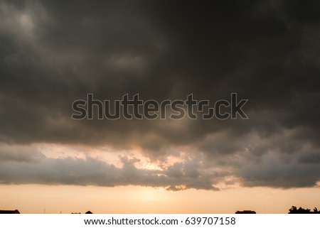 black sky Background of dark clouds before a thunder.
sunlight through very dark clouds background of dark storm clouds