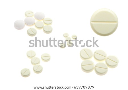 Set of white pills on white background