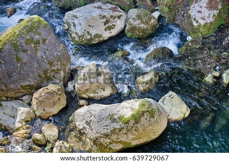 Mountain creek among boulders