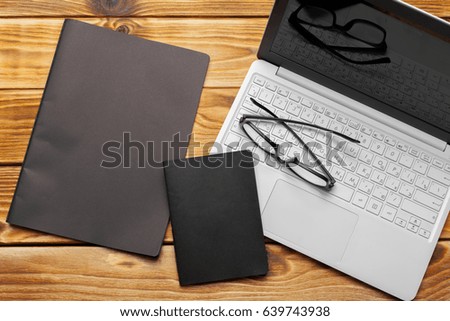Laptop, notebook on work wooden desk 