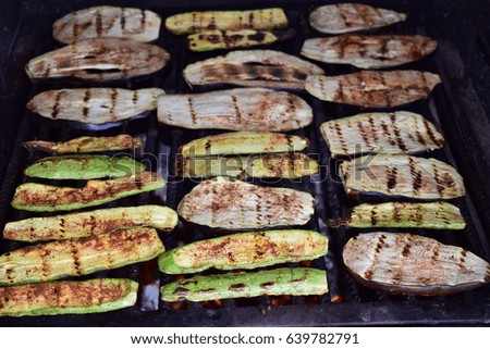 Fresh pumpkin and eggplant slices on the grill