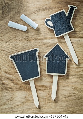Composition of black wooden chalkboard price sign tags on wood board agriculture concept.