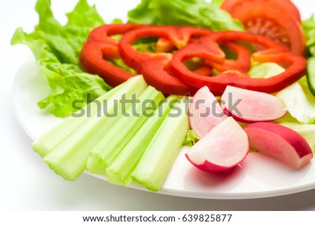 Vegetable salad, vegetarian, lettuce, pepper, cucumber, radish, onion, tomato, celery, fork knife, white background