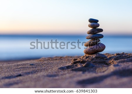 Pebble tower on the seaside Royalty-Free Stock Photo #639841303