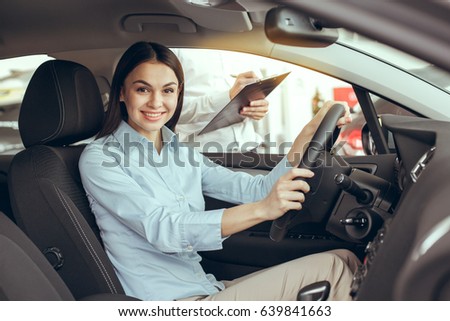 Young Woman in a Car Rental Service Test Drive Concept