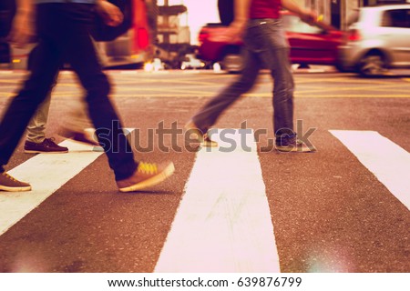 Anonymous people walking down the pedestrian lane. Everyday commuters. blurred. Royalty-Free Stock Photo #639876799