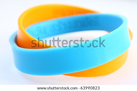 Yellow and light blue rubber bracelet. Yellow is colour of King, light blue is Queen of Thailand.