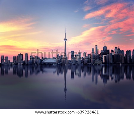 Toronto Skyline at night with a reflection in Lake Ontario, Ontario, Canada 