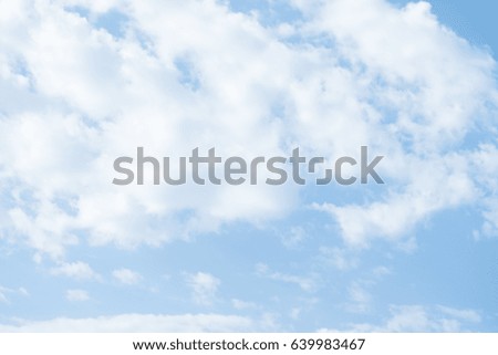 Small cirrus clouds against a blue sky