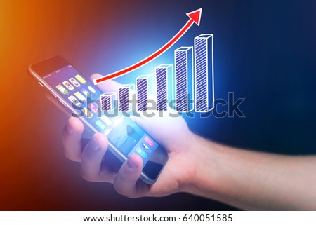 Concept view of business graph icon flying out a smartphone - technology concept