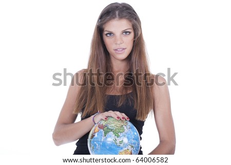 Pretty smiling woman holding the world globe in her hands