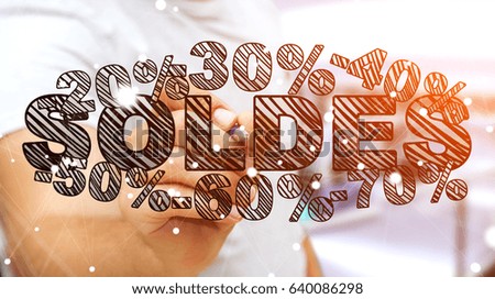 Businessman on blurred background touching sales icons with a pen 3D rendering ("soldes" means sales in french)