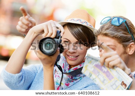Smiling couple with the camera