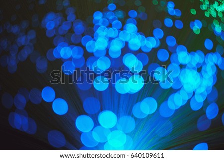 Blurred LED screen closeup. Glowing threads in a color spectrum on a black background. Bright abstract background ideal for any design                                  