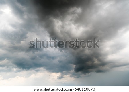 black sky Background of dark clouds before a thunder.
sunlight through very dark clouds background of dark storm clouds