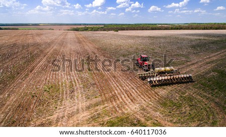 tractor preparing land for sowing sixteen rows aerial