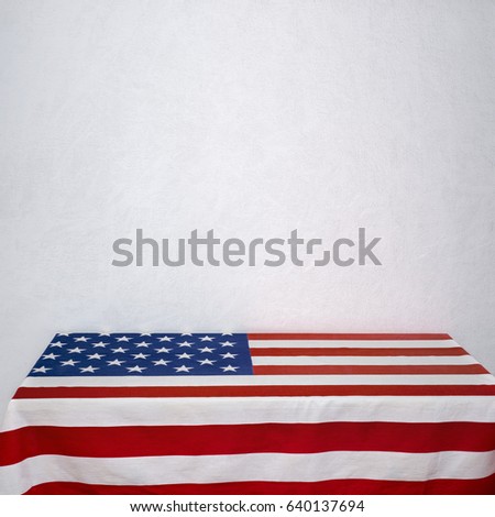 American flag table near the white stucco wall
