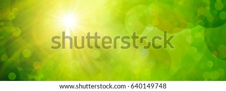 Abstract green background with bokeh and sun