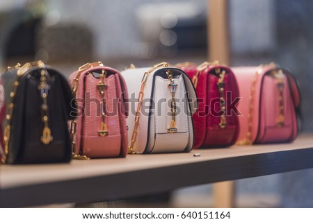 Woman purses in a store in Paris. Royalty-Free Stock Photo #640151164