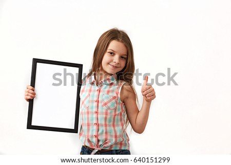 Cute girl holding a blank sign