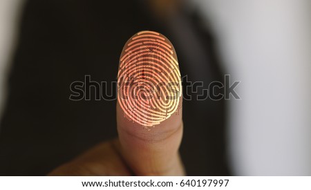 Businessman login with fingerprint scanning technology. fingerprint to identify personal, security system concept                                     Royalty-Free Stock Photo #640197997