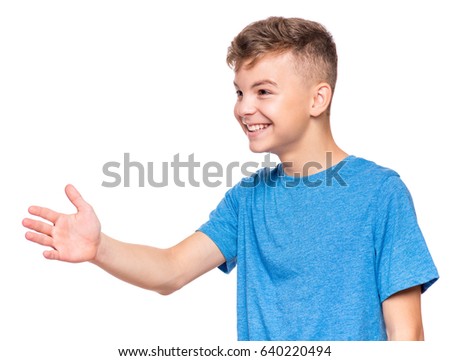 Half-length emotional portrait of caucasian teen boy wearing blue t-shirt, handshake gesturing. Funny teenager with open hand ready for handshake, isolated on white background. Handsome happy child