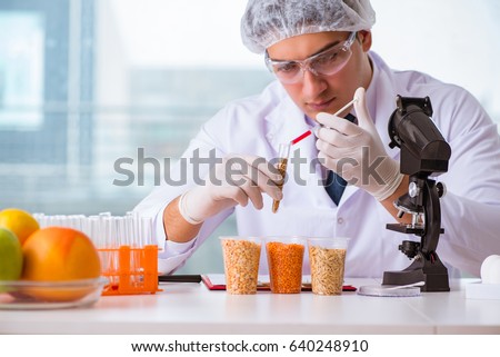 Nutrition expert testing food products in lab Royalty-Free Stock Photo #640248910